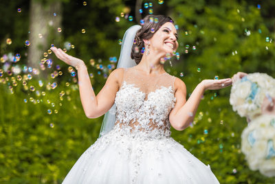 Bride surrounded by soap bubbles