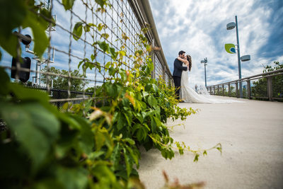 Married couple kissing on Schuylkill River Path