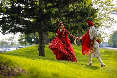 Sikh Indian couple laughing on their wedding day