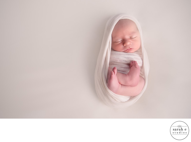 Newborn Baby Boy Wrapped in White Newborn Baby Boy Wrapped in White