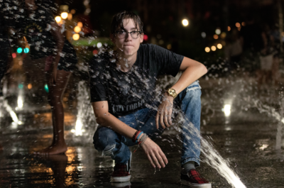 Night photoshoot with teen in fountains