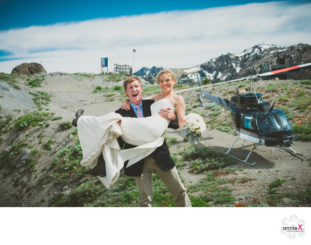 Bride and groom on top of Kt-22 with helicopter