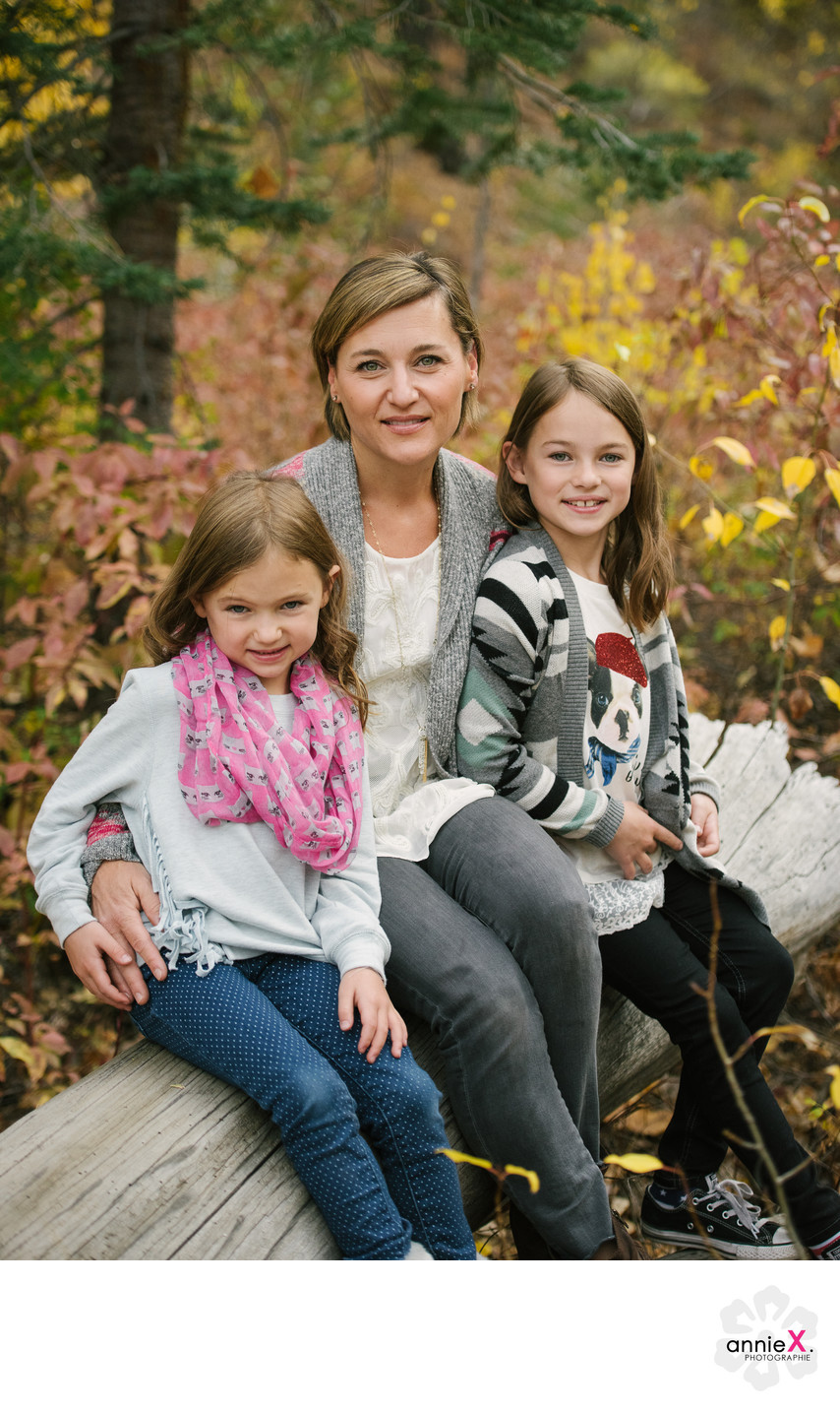 Mother and daughters with fall foliage