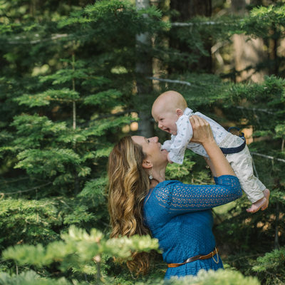 mother and baby in pine trees in Lake Tahoe