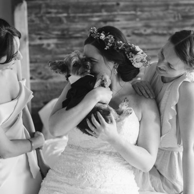 Bridesmaids bride and her dog while getting ready