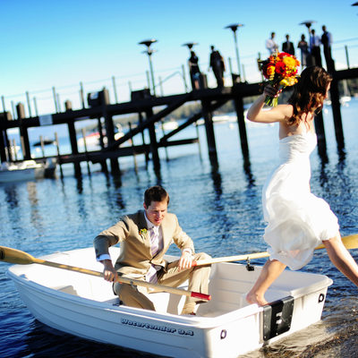 Bride and Groom in rowboat at West Shore Cafe
