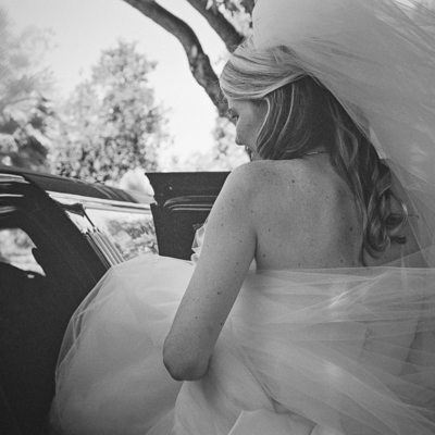 Bride getting in Limo to her ceremony in San Mateo