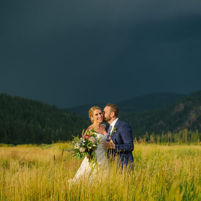 Dark storm skies with bride and groom 