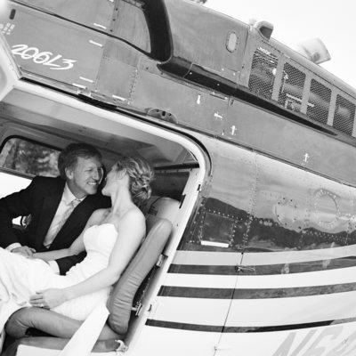 Bride and groom in helicopter getting ready for takeoff