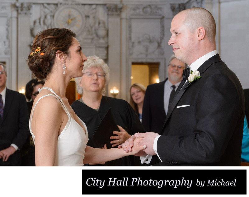 Exchanging rings City Hall ceremony with officiant in SF