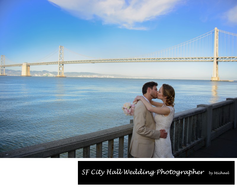 San Francisco Bay Bride Wedding Photo over the water with a kiss