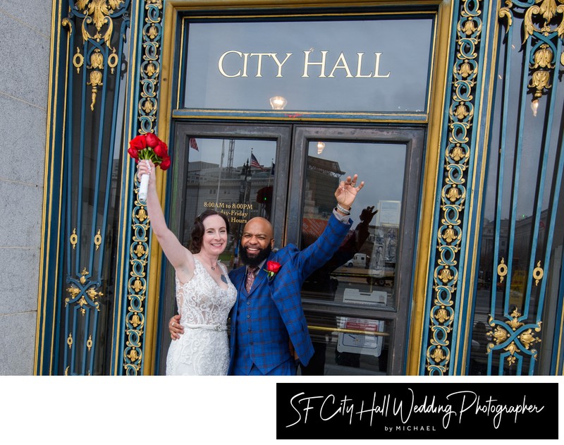 Mixed race couple celebrating at City Hall