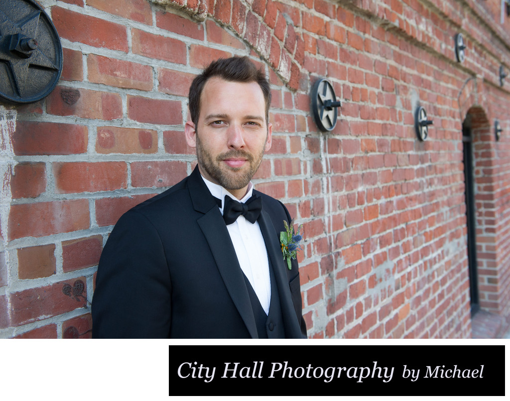 Wedding Photographer San Francisco City Hall - Groom in Bricks