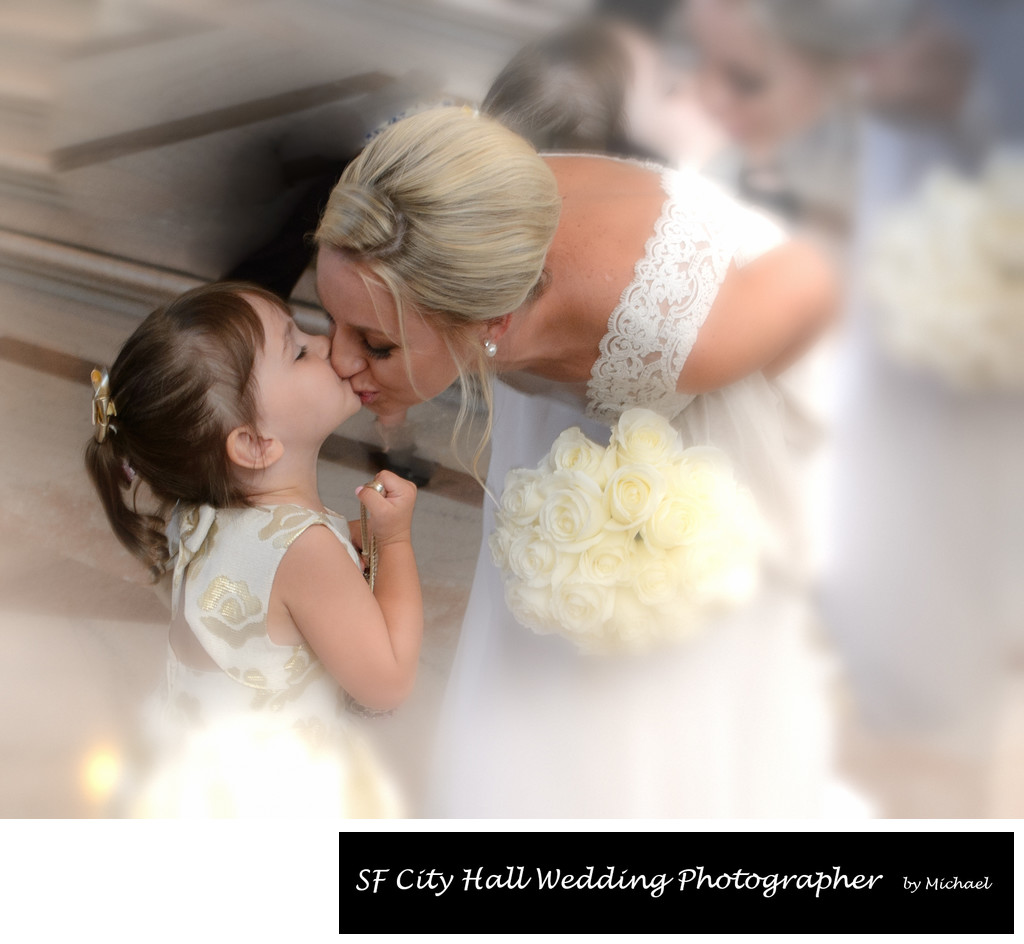 Bride Kissing her Flower Girl Moments before Wedding Ceremony