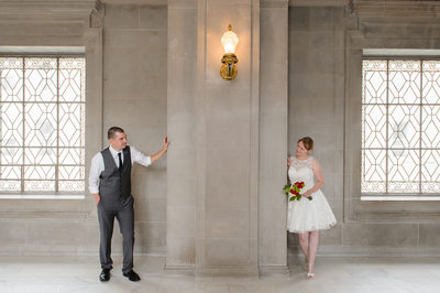 Dual windows peak around pose - City Hall Wedding Photographers