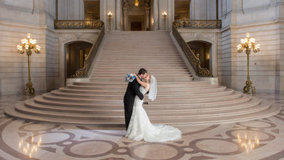 Grand staircase kiss with Professional Photographic Back Lighting