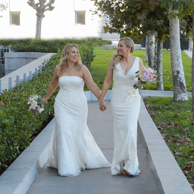 Lesbian wedding holding hands walking in San Francisco