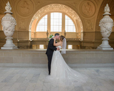 SF City Hall Bride and Groom Kiss on the 4th Floor North Gallery