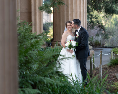 Candid Kiss at the SF Palace of Fine Arts with Bride and Groom