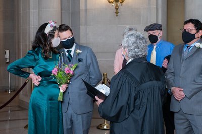 bride and groom wear masks for their sf city hall ceremony
