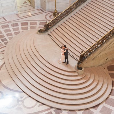Top Angle view of San Francisco city hall wedding couple on Staircase