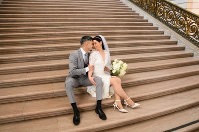 Newlywed bride and groom share a moment at San Francisco city hall