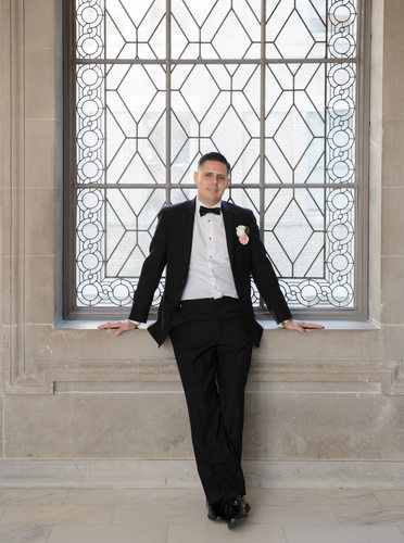 Portrait of Groom in Window - Wedding Photography Image