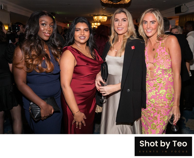 Guests in evening gowns posing at a black-tie awards reception Grosvenor House Guests in evening gowns posing at a black-tie awards reception Grosvenor House