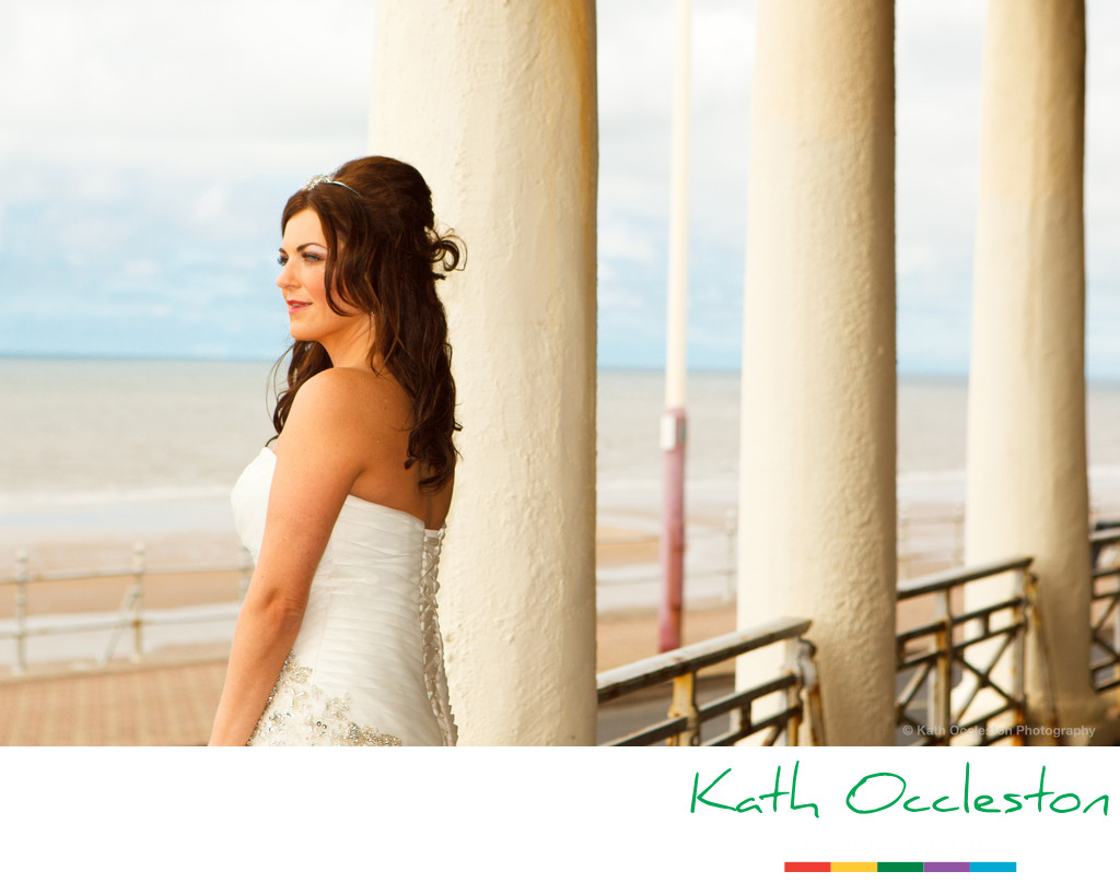 Bride looking out to sea on Blackpool promenade