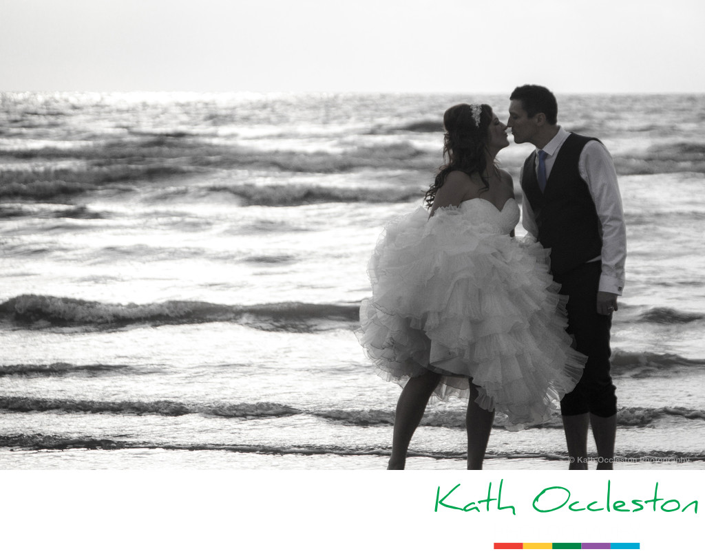 Bride & Groom at the edge of the sea
