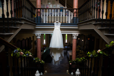 The Wedding Dress hanging up on the stairs