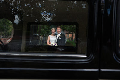 Creative wedding photography with the wedding car
