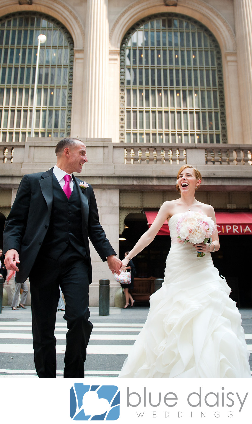 Wedding couple walking in front of Ciprianis NYC
