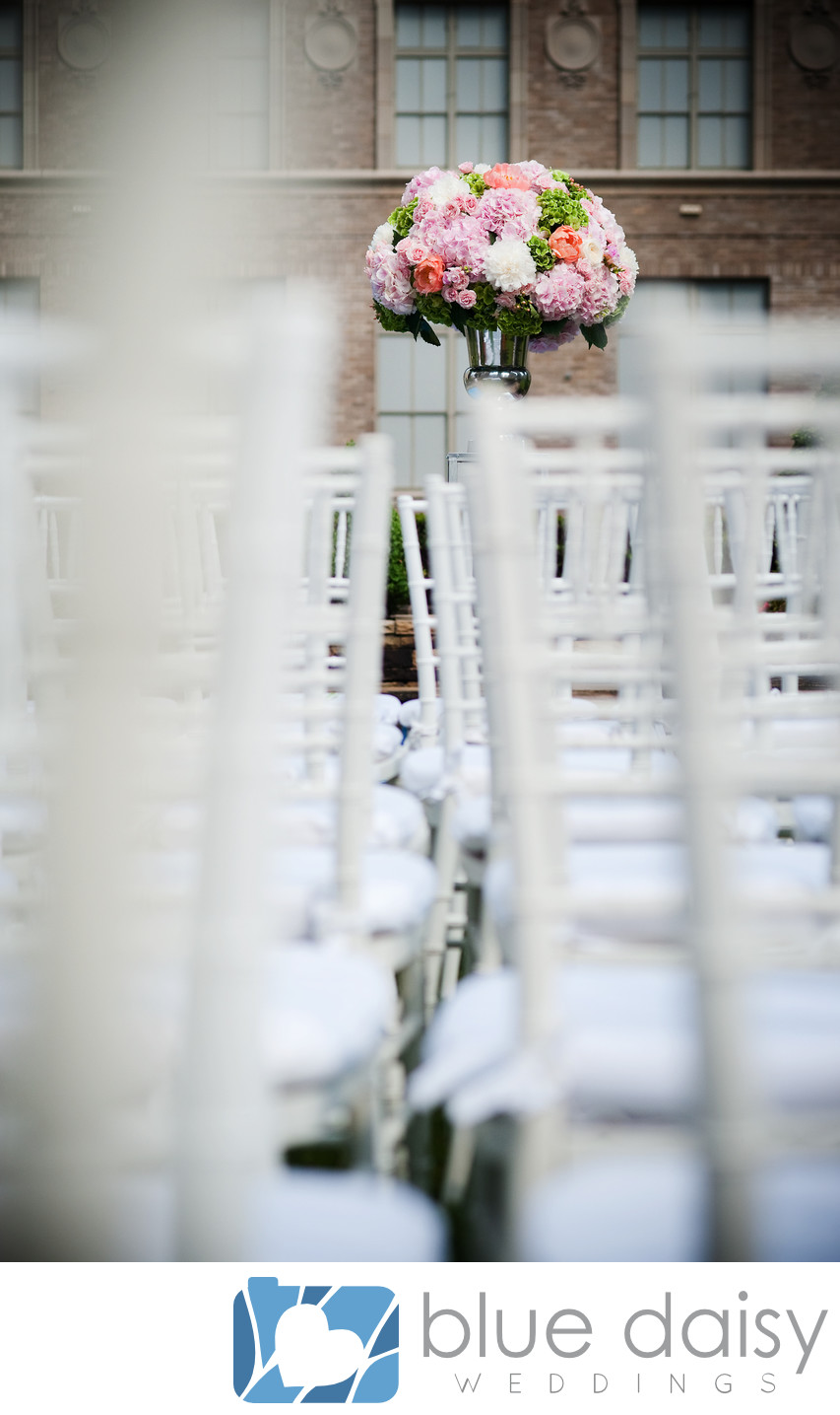 White chairs for NYC rooftop garden wedding ceremony