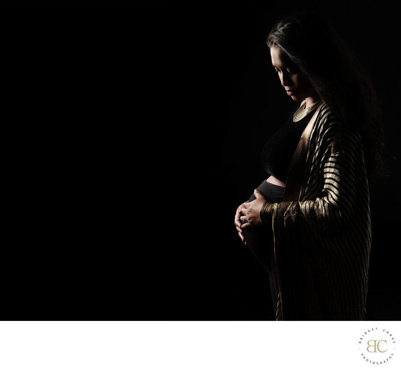 Elegant Gold-Trimmed Robe Maternity Portrait in Studio Elegant Gold-Trimmed Robe Maternity Portrait in Studio