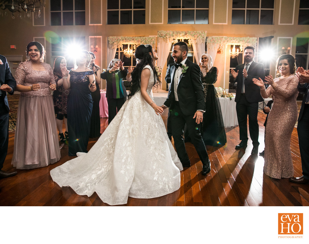 Bride and Groom dance among their guests at reception