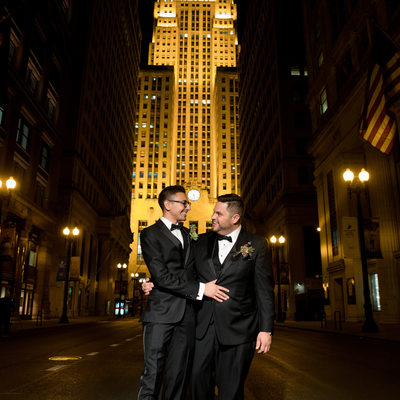 Gay Couple in Front of Chicago Board of Trade at Night