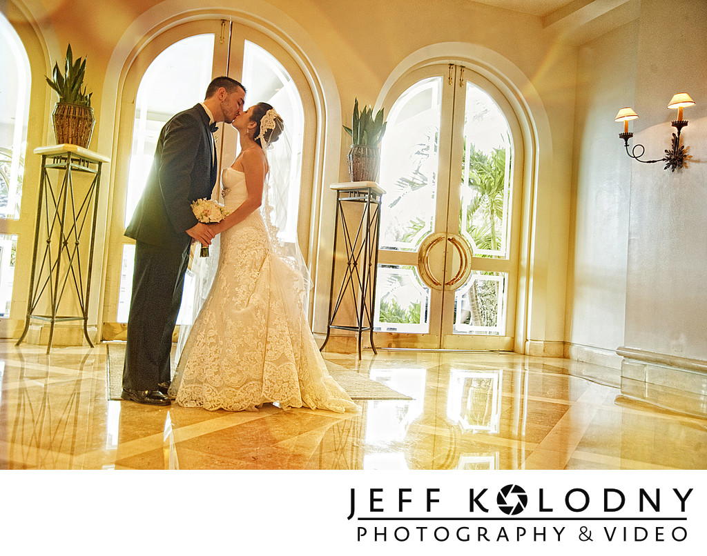 Bride and groom kiss at the Four Seasons