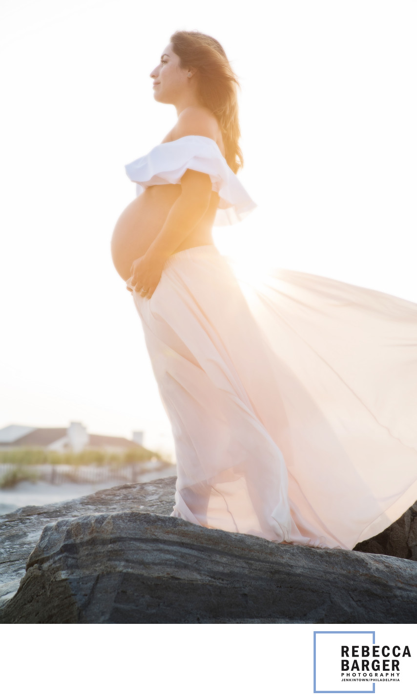 Mother-to-be at sunset, on the Ocean City, NJ,  shoreline. 