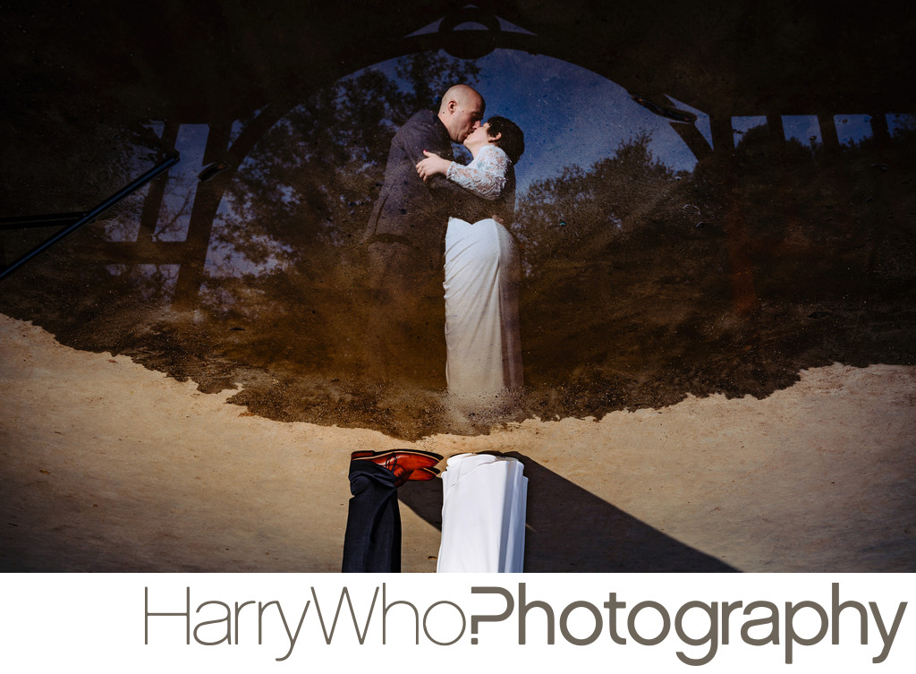 An image of water reflection of a couple married at Los Gatos Oak Meadow Park