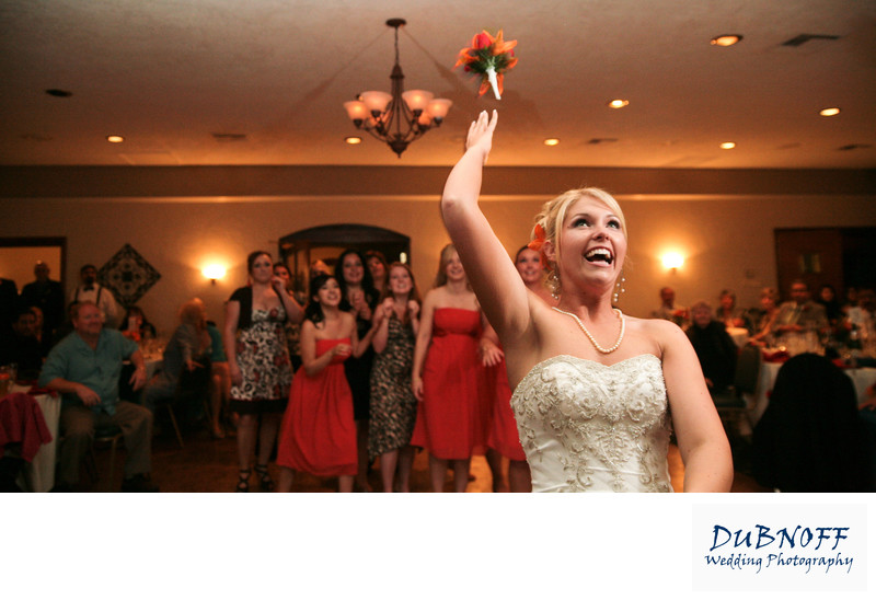 Bride throws her bouquet at the Contra Costa Country Club in Pleasant Hill, California