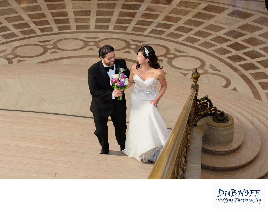 bride and groom work there way up the Grand Staircase