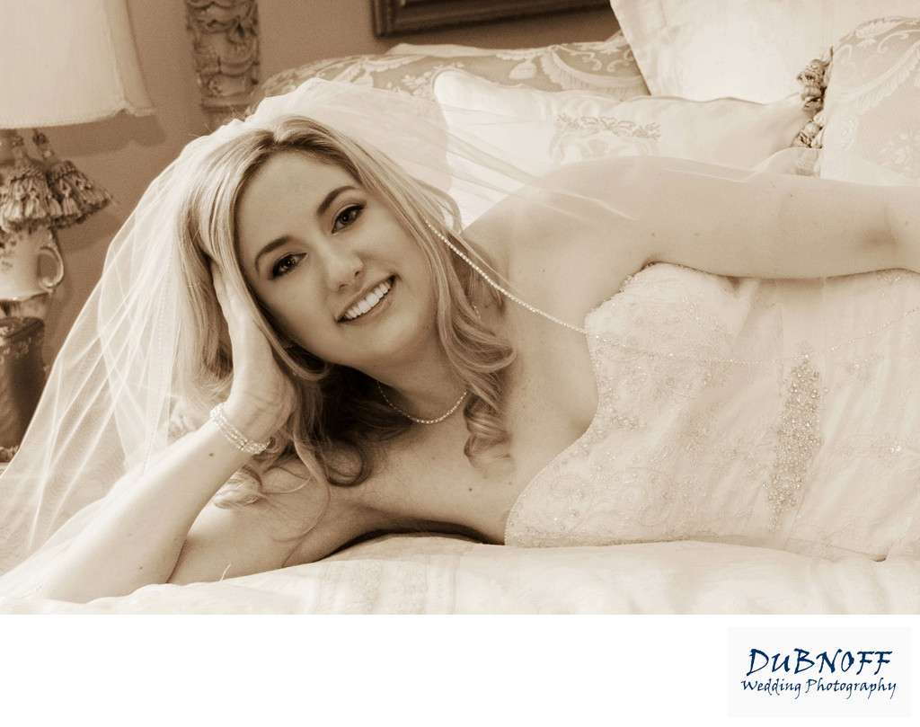 sepia bride across grand bed at Jefferson St. Mansion