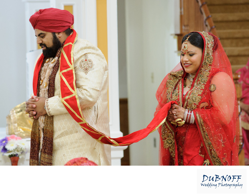 Sikh Wedding Ceremony bride and groom walking around the table