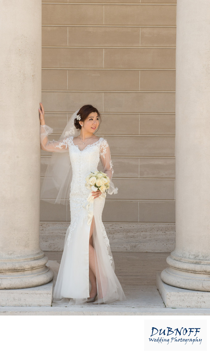 bride looking away at legion of honor in San Francisco after City Hall wedding