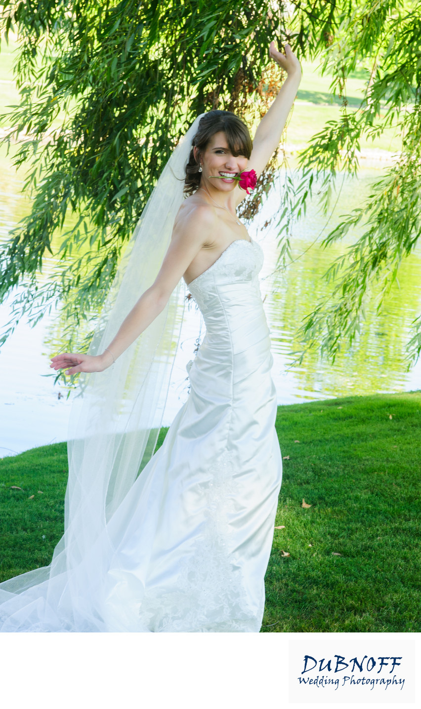 bride with rose in mouth in the San Francisco Bay Area