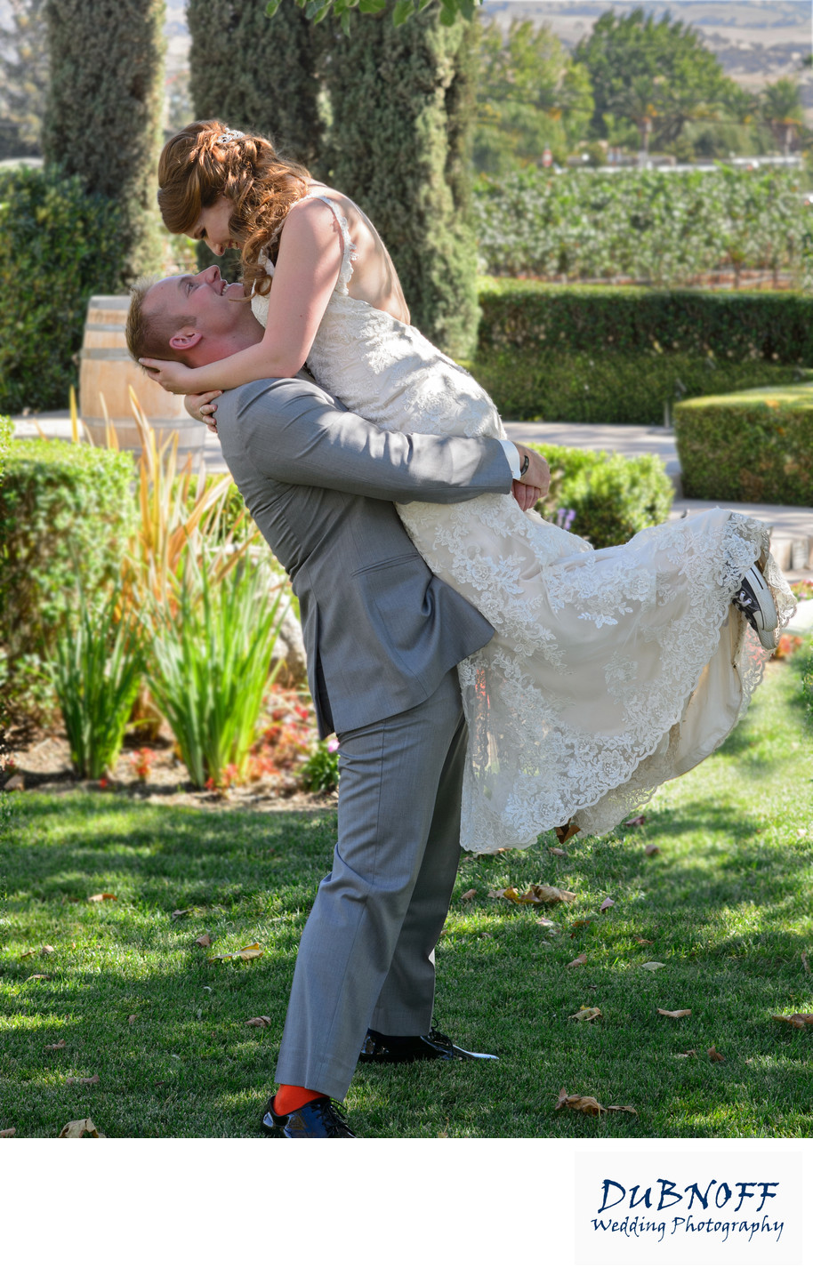 Groom Lifting Bride at Garre Vineyards in Livermore