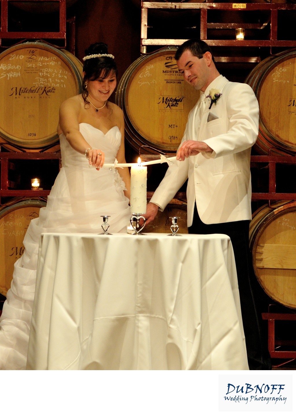 Bride and Groom Lighting Candles at the Palm Event Center