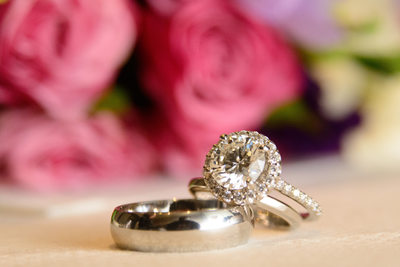 rings and flowers at wedding close up detail image.