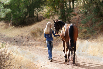Girl and Horse Walking away in Beautiful Natural Light
